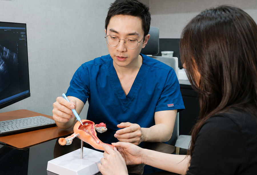 Dr. Kil consulting with a patient